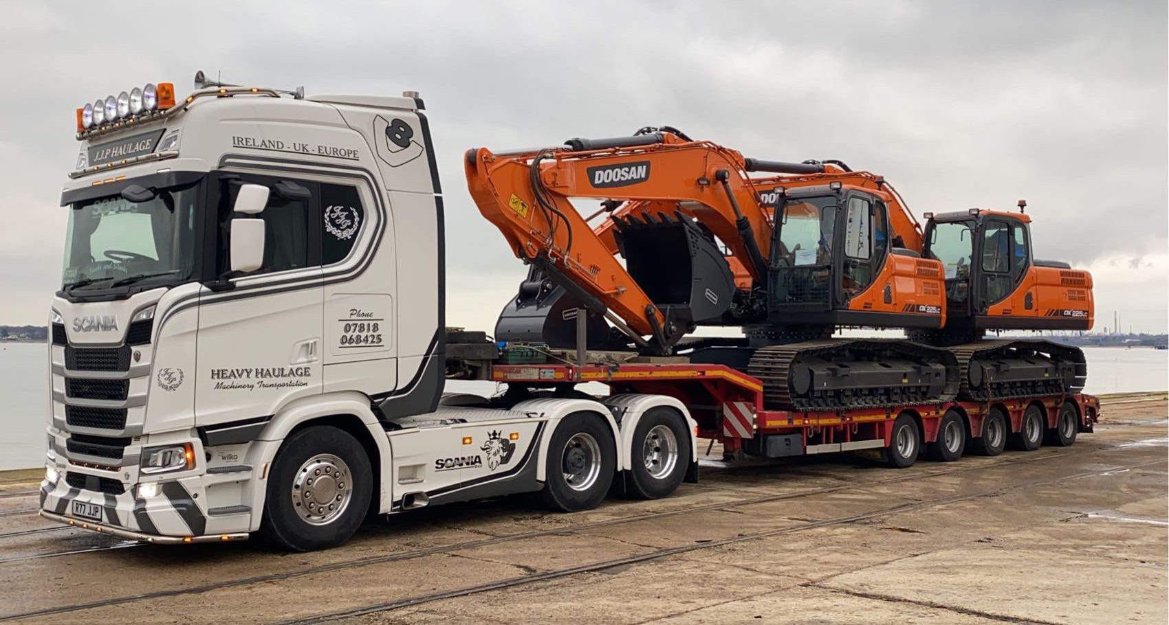 JCB cargo on the back of JJP Haulage Ltd Scania Lorry