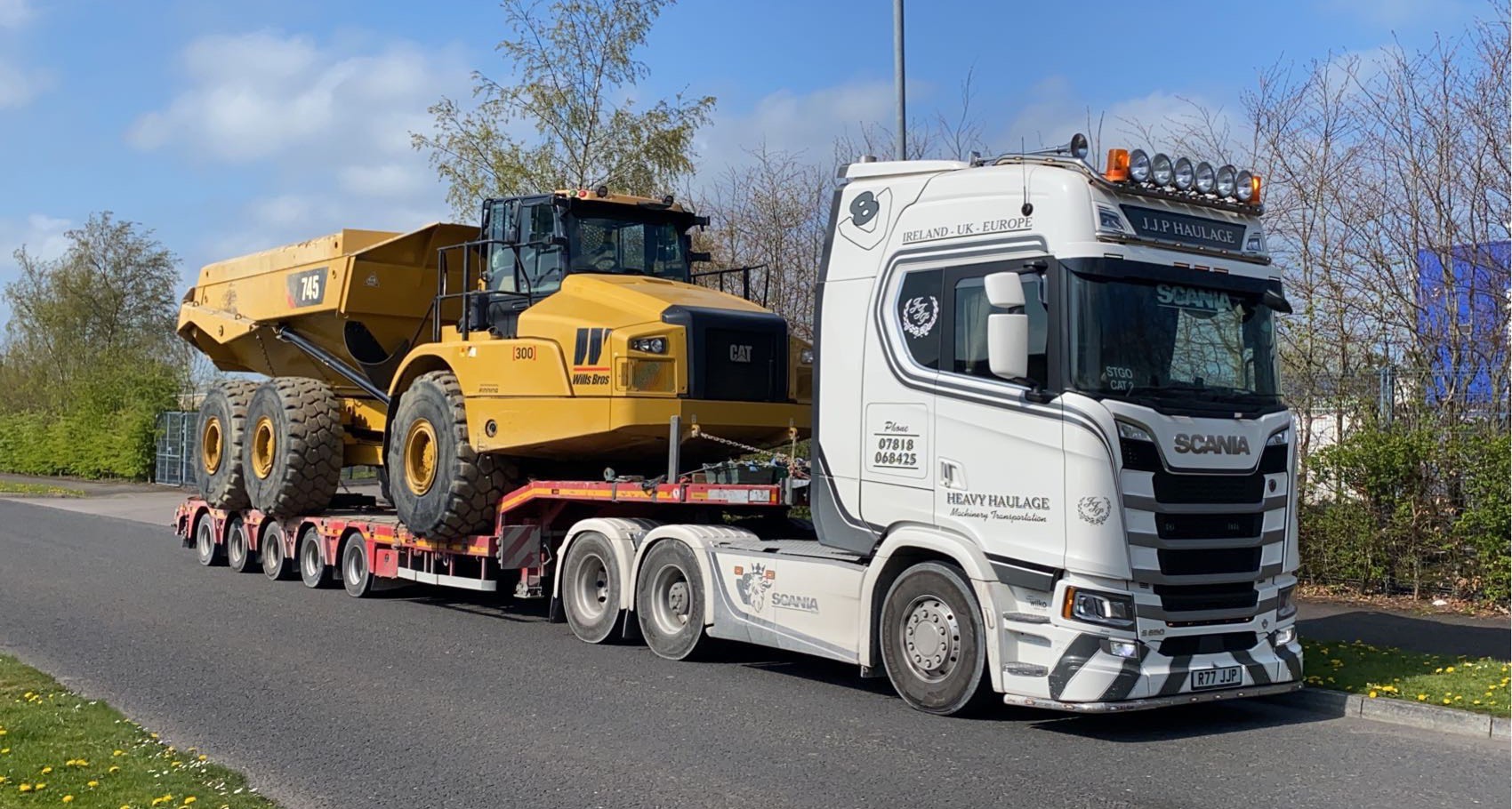 Heavy cat lorry on JJP Haulage Ltd Scania Lorry