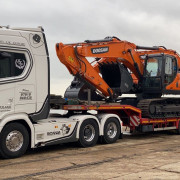JCB cargo on the back of JJP Haulage Ltd Scania Lorry